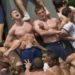 A Shitload of Pictures Of Half-Naked Greased Up Military Men Climbing A Stone Monument